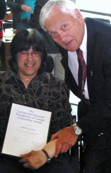 Past Chair Fred Chalk presenting bursary to Somona Gupta Past Chair Fred Chalk presenting bursary to Somona Gupta